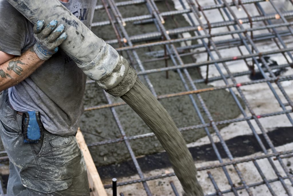 concrete being poured using concrete ground line pump